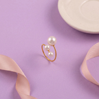 Flat lay of Triple Pearl Open Ring