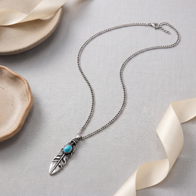 Flat lay of Blue Stone Feather Pendant Necklace