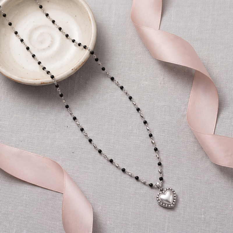 Flat lay of Black Beaded Heart Pendant Chain