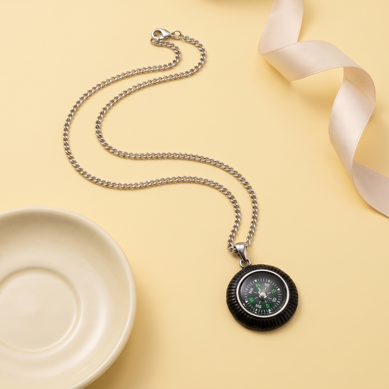 Flat lay of Compass Pendant Chain
