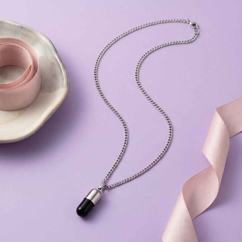 Flat lay of Black Capsule Pendant Chain