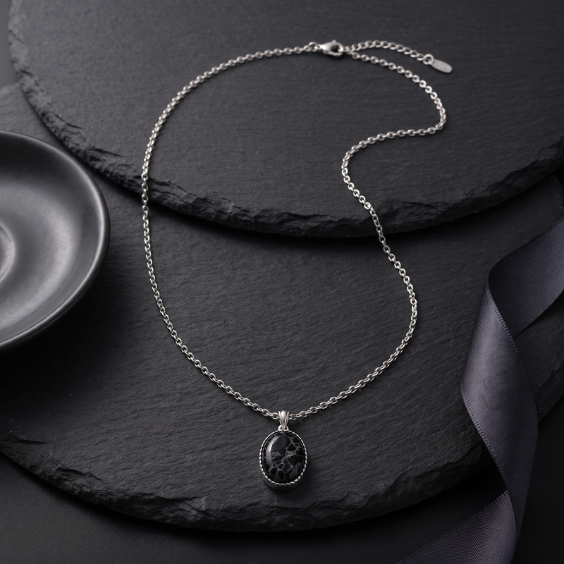Flat lay of Black Oval Pendant Chain