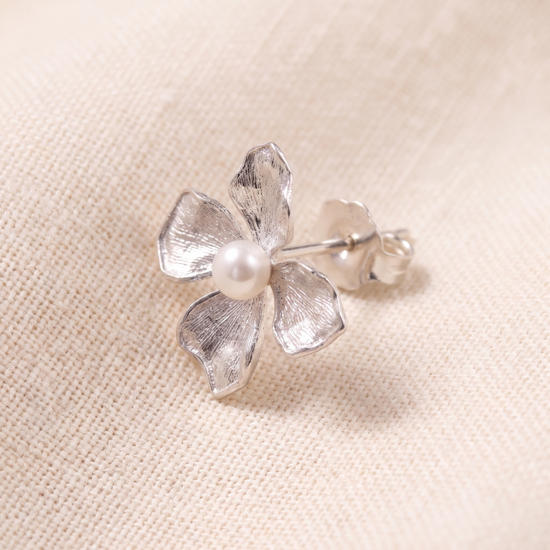 Close-up detail of Silver Floral Pearl Stud Earrings