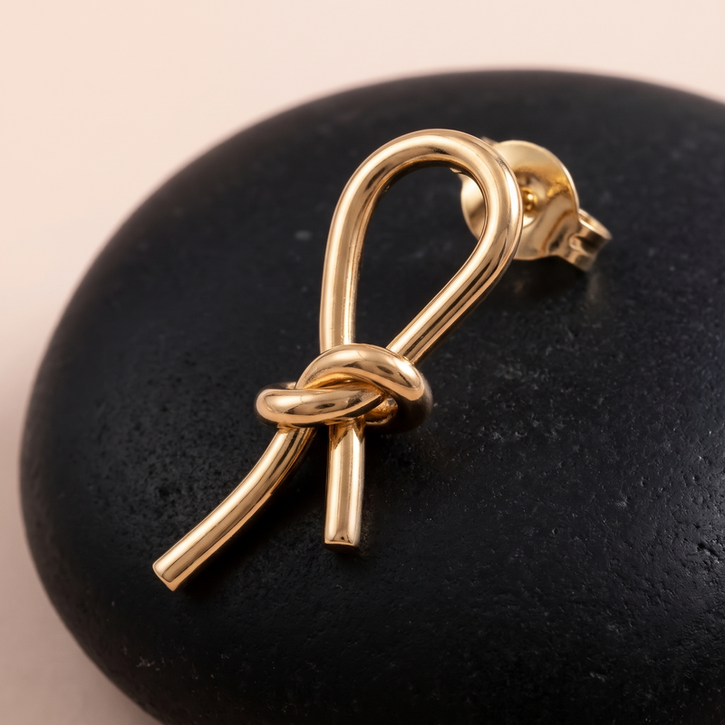 Close-up detail of Gold Knot Drop Earrings