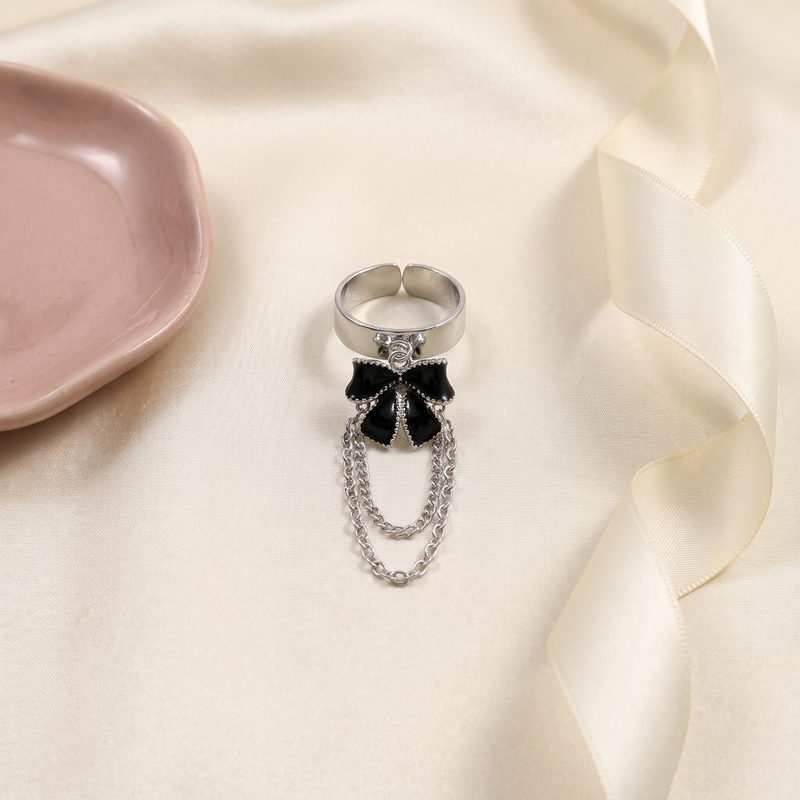 Flat lay of Black Bow Draped Chain Ring