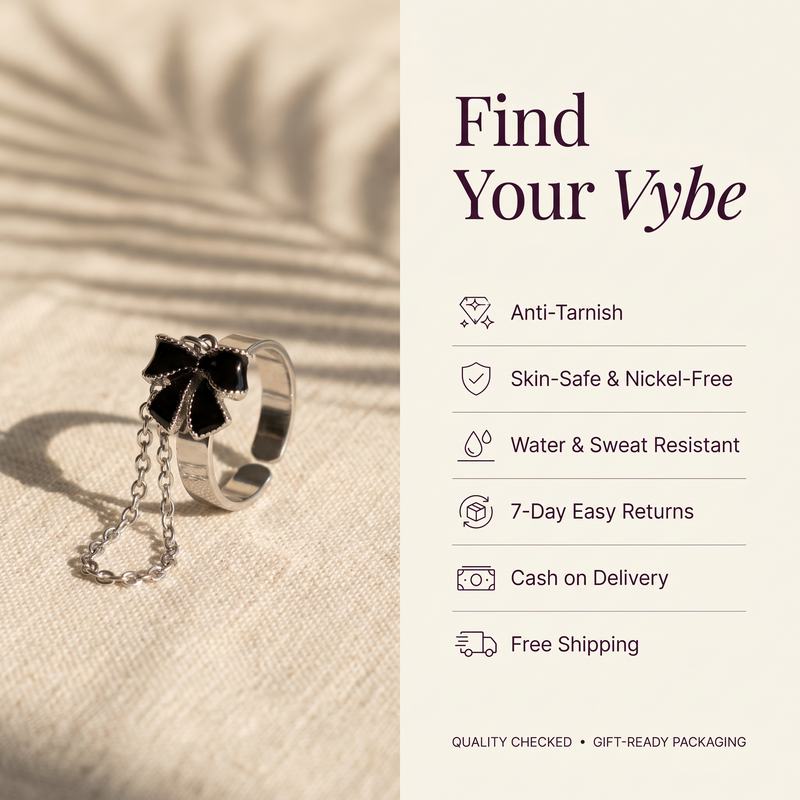 Features and promises: Black Bow Draped Chain Ring
